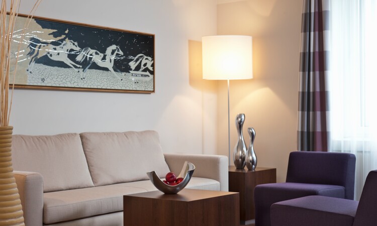 Sofa and armchair in Junior Suite at the Estrel Berlin